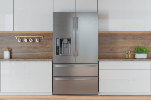 Modern Kitchen With Front View Of Refrigerator And White Cabinets