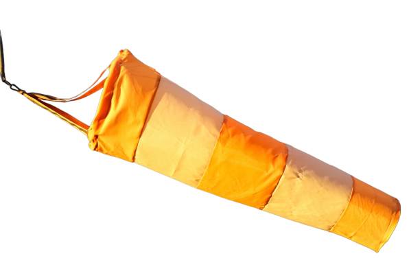 Airport Orange And White Windsocks blowing in the wind over blue sky with clouds