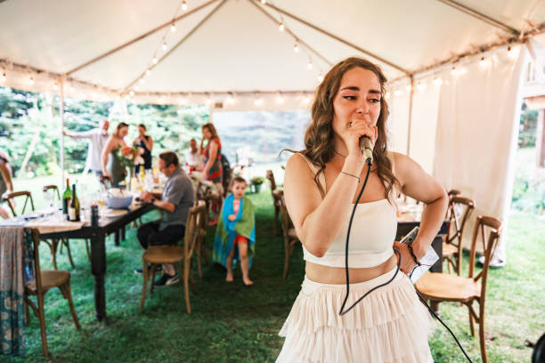 istock Bride singing karaoke at the wedding party 2162688165