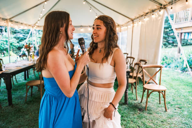 istock Bride and her girlfriends singing karaoke at the wedding party 2162688196