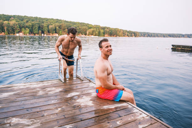 istock Young men having fun at the lake 2162688252