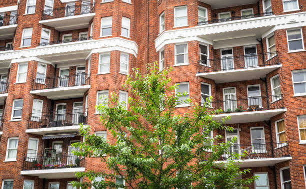 The front facade of traditional apartments with balconies in Hampstead, west London, England.