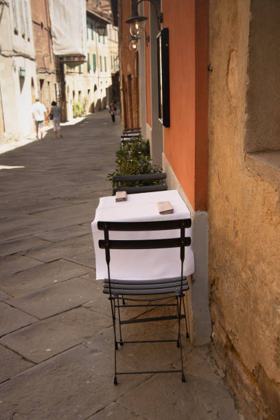 istock Laid Table on Paved Alley in Montalcino 2162692925