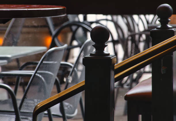istock Metal railing in an unoccupied section of a restaurant 2162695055