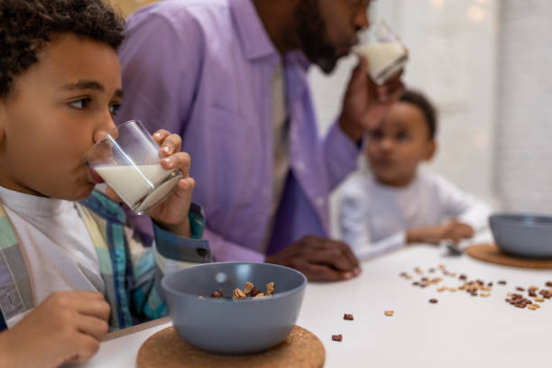 istock Father and kids having breakfast together in the kitchen 2162697797