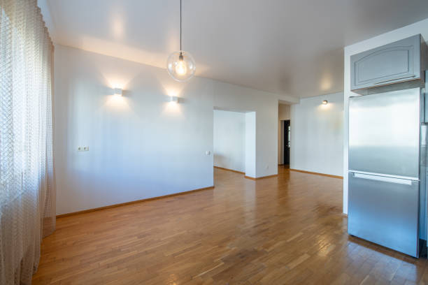 Classic Home Open Space Kitchen Interior. Wooden Floor, Minimalistic Interior Design. Fridge in Background