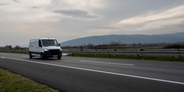 istock White cargo van at the open highway at sunset 2162699264