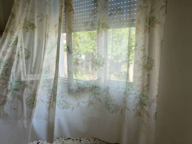 istock fluttering curtain in bedroom during the day 2162703188