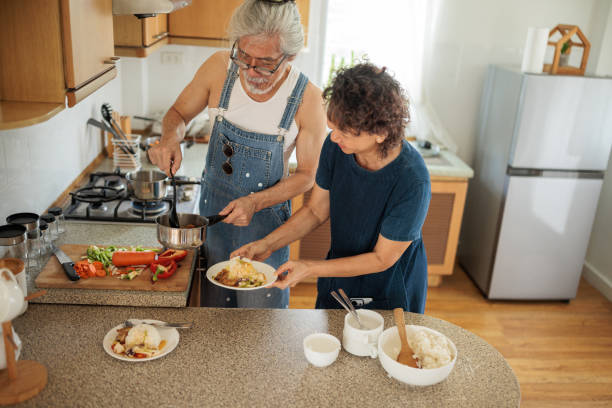 istock Married Couple Cooking a Meal 2162704693
