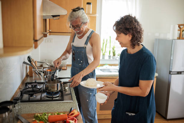 istock Elderly Couple Cooking a Meal together 2162704704