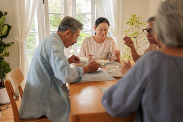 istock Old friends enjoying a meal together 2162705059