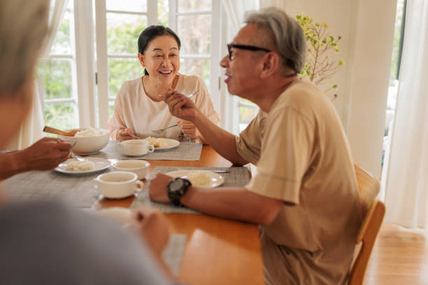 istock Old friends enjoying a meal together 2162705118