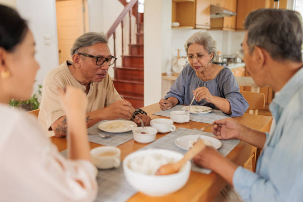 istock Old friends enjoying a meal together 2162705135