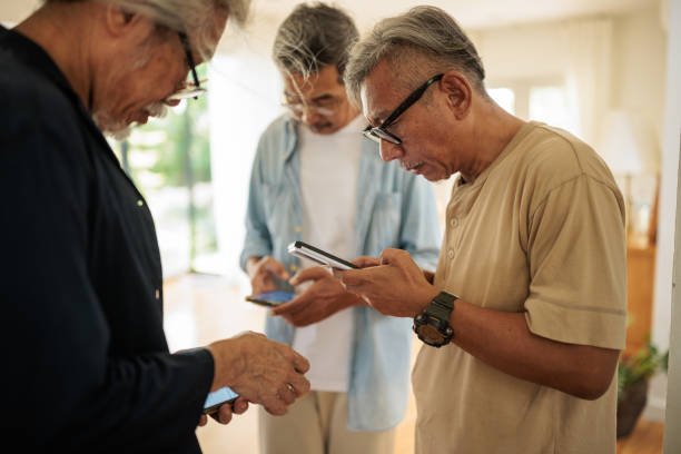 istock Male senior friends using phones 2162705347