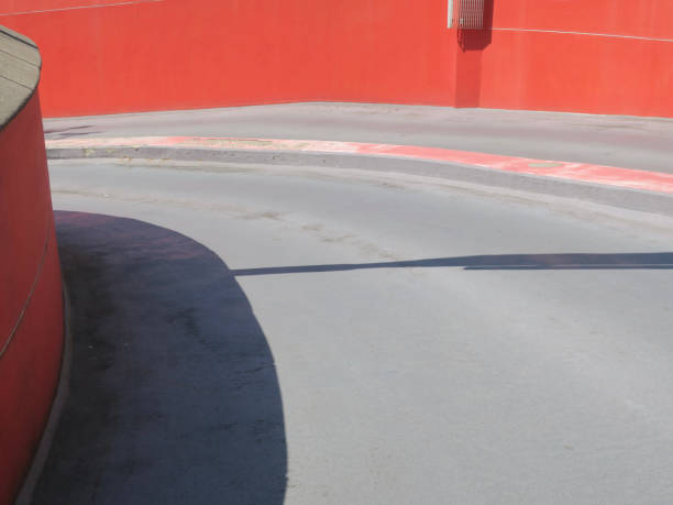 istock road turning down to the parking garage 2162705484