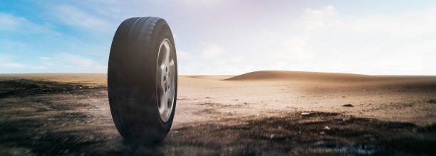 concept - car tires rolling through the desert at full speed