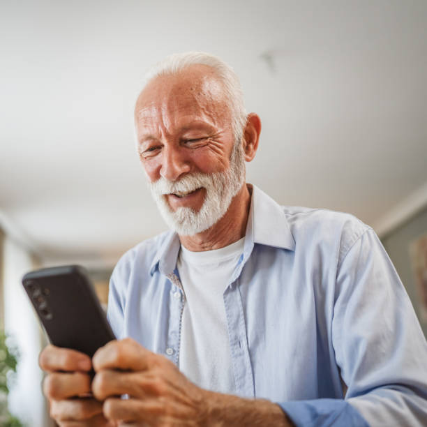 istock Senior caucasian man use a mobile phone at home 2162709295