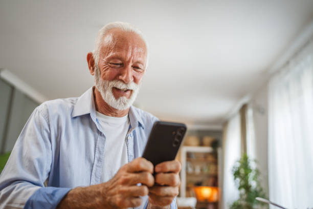istock Senior caucasian man use a mobile phone at home 2162709347