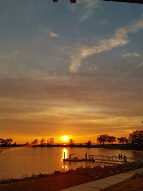 istock Dramatic sky and sun at sunset on Lake Erie 2162716153