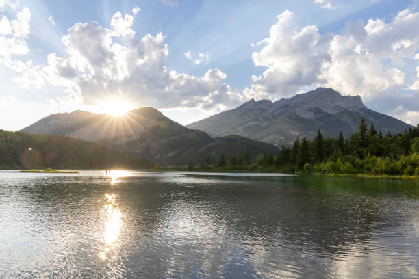 istock Sunrise over lake and mountains 2162717240