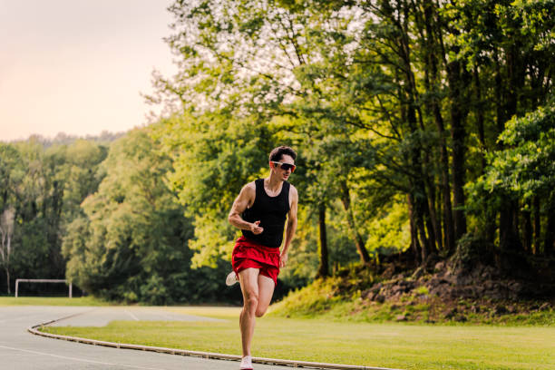 istock Sprint runner training outdoors on his own in the afternoon 2162720086