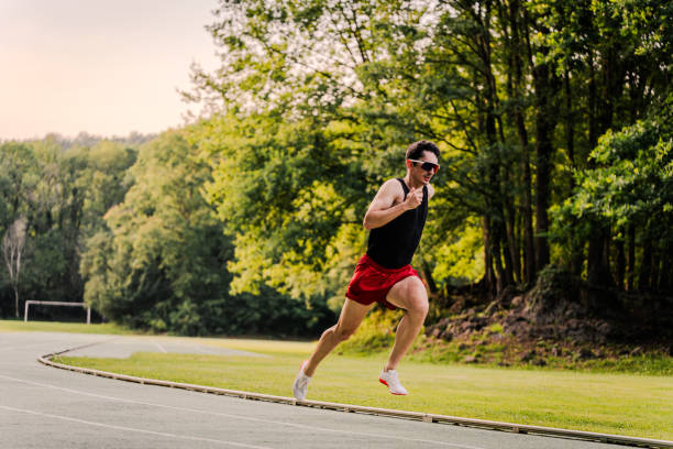 istock Professional athlete running fast in an athletics track race 2162720093