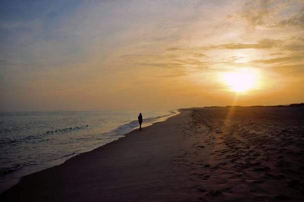 istock Solitary Stroll at Sunset 2162721289