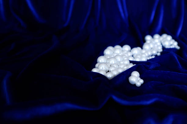Beautiful Pearls Against Plush Velvet Blue Backdrop