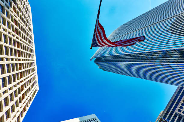 istock Low Angle view of skyscrapers against blue clear sky 2162729412
