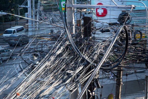 Manila, Philippines- 14 Oct 2023: Messy cables and tangled wires - chaotic infrastructure of Manila