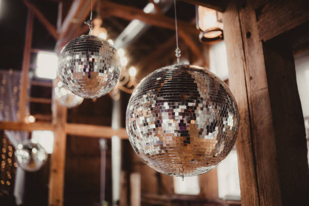 Disco balls hanging from the ceiling at a wedding