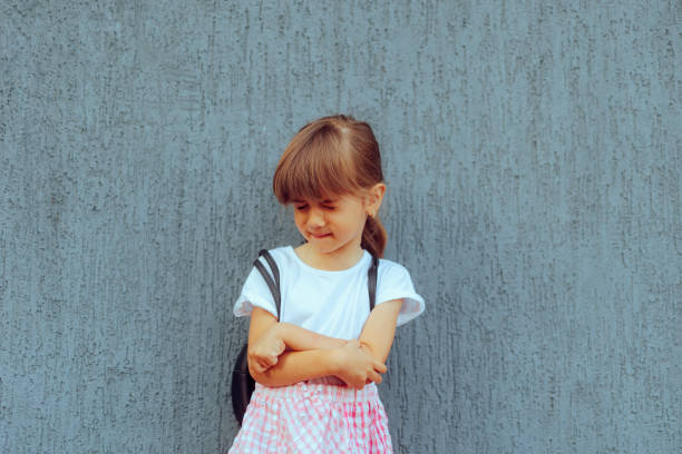 Frustrated schoolgirl feeling emotional and distressed