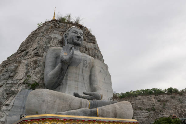 istock big carving Buddha statue at Wat Khao Tham Thiam, Suphan buri 2162739231