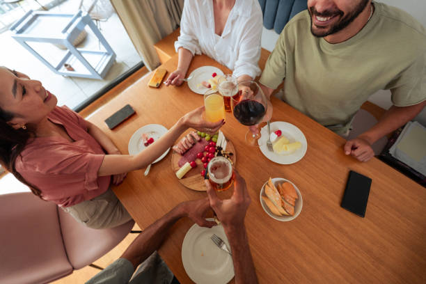 istock Diverse Group of Friends Gathering for Meal 2162743617