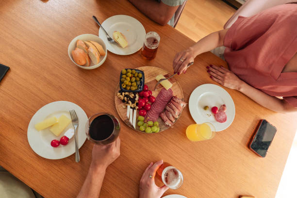 istock Friends Enjoy Casual Gathering with Stylish Table Setup 2162743647