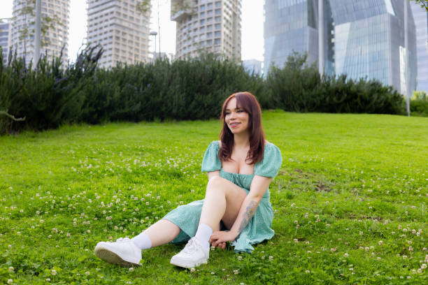 Young woman taking her time in a park at Santa Fe in Mexico City