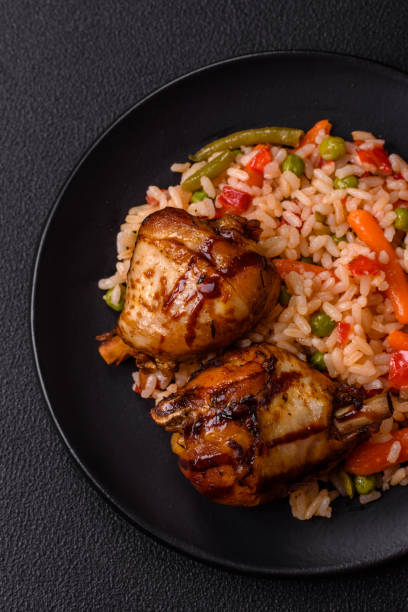 istock Delicious grilled chicken legs with spices and herbs 2162746418