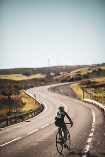 istock Woman cyclist training on the road 2162748239