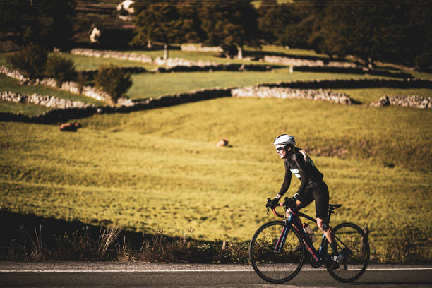 istock Woman cyclist training on the road 2162748245