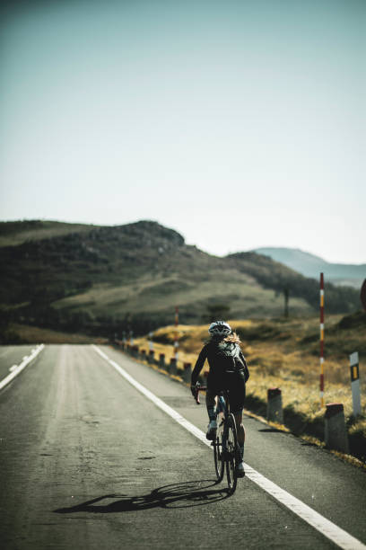 istock Woman cyclist training on the road 2162748246