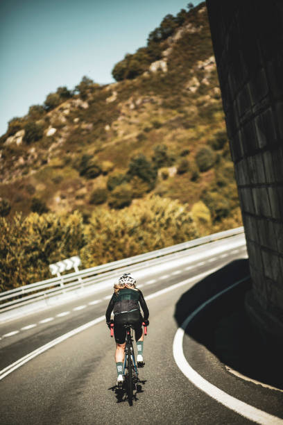 istock Woman cyclist training on the road 2162748267