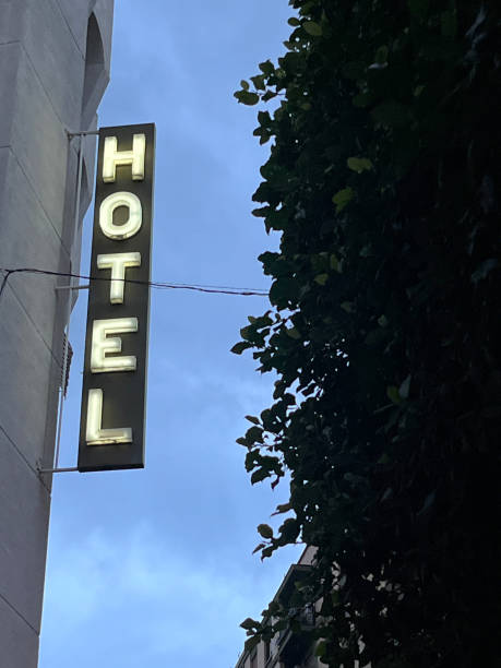 istock Illuminated hotel sign at dusk 2162748500