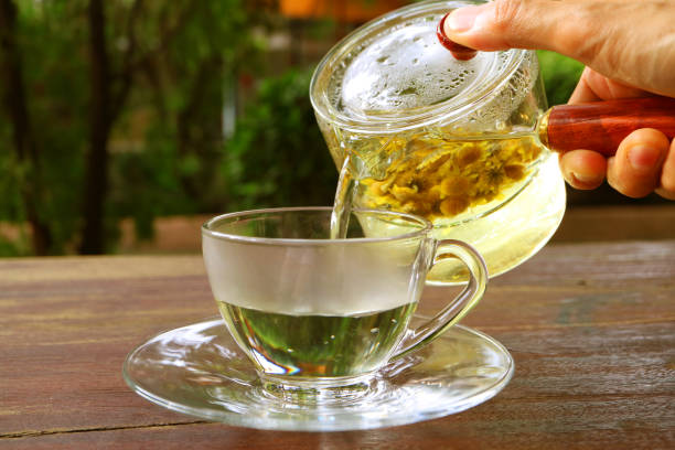 istock Hot Chrysanthemum Tea Being Served on the Garden Table 2162752150