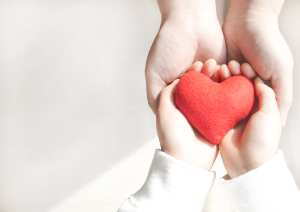 istock Image background of two people handing over their hearts 2162752507