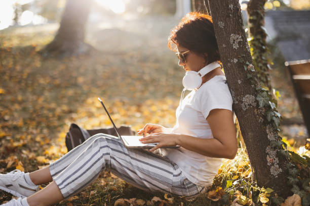 istock Woman working in autumn nature 2162753896