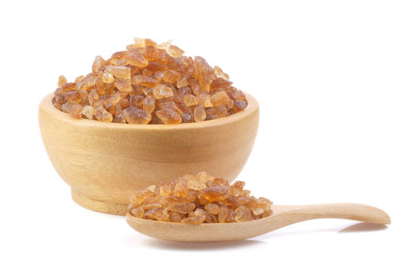 istock Brown rock sugars close up on white background. 2162755954