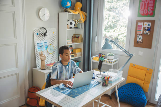 istock Teenage boy studding at home 2162757409