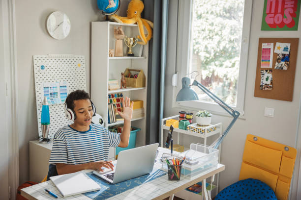 istock Teenage boy studding at home 2162757410