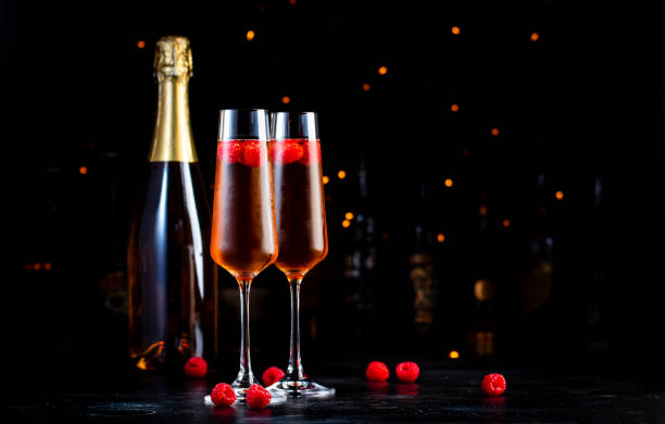 istock Raspberry summer cocktail drink with champagne, raspberry puree and ice, dark bar counter background 2162757804