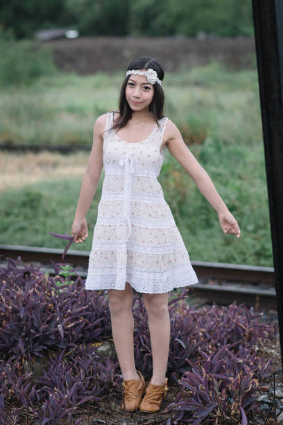 istock cute woman in white 2162758336